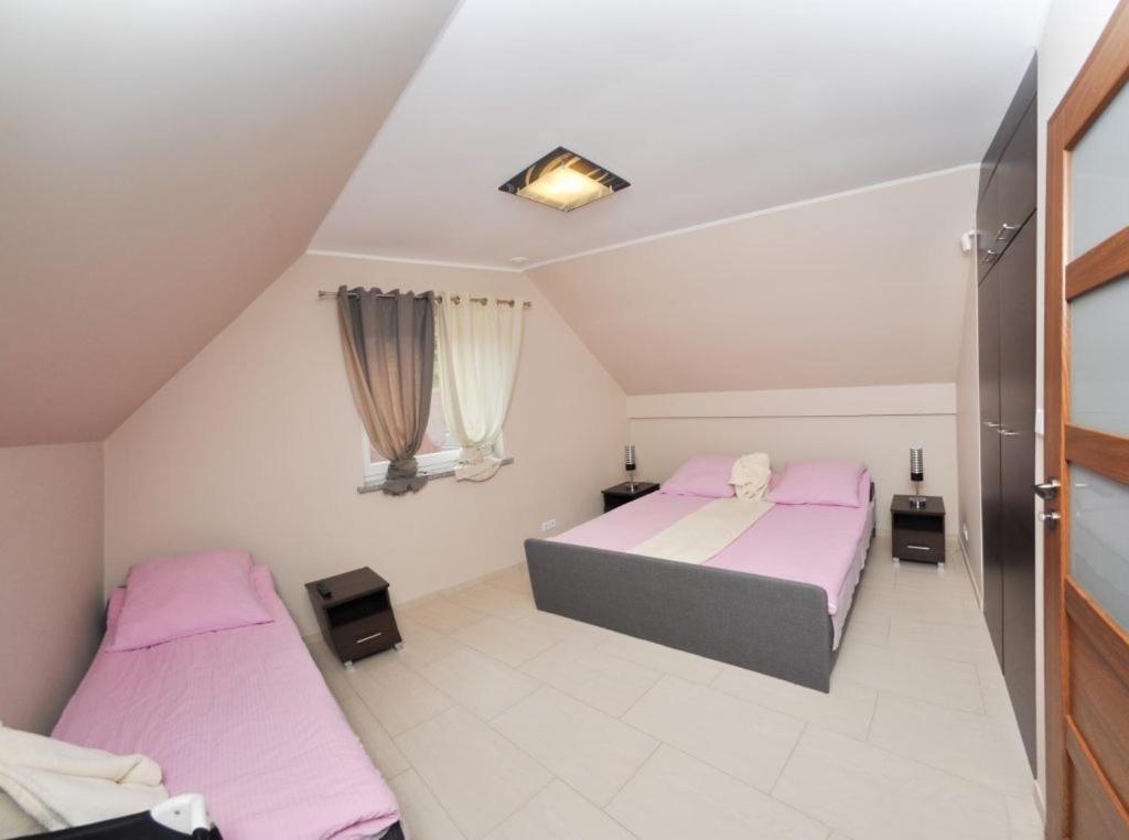 Ferienhaus Holiday Home Domki RAJ Jarosławiec Eksteriør billede